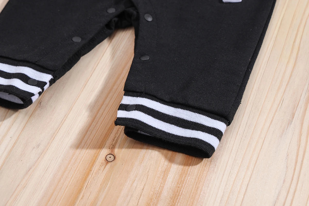 Fabric and texture detail of baby boys hooded baseball romper jumpsuit