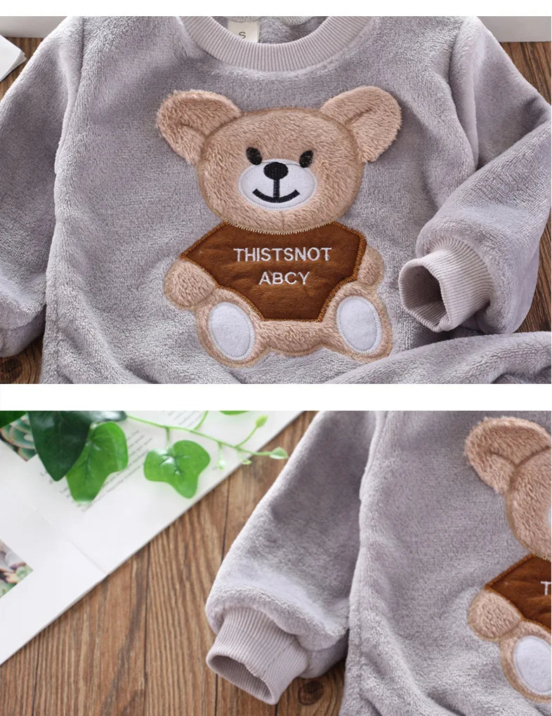 Focus on the neckline and sleeve features of the kids flannel fleece cartoon bear pyjama set