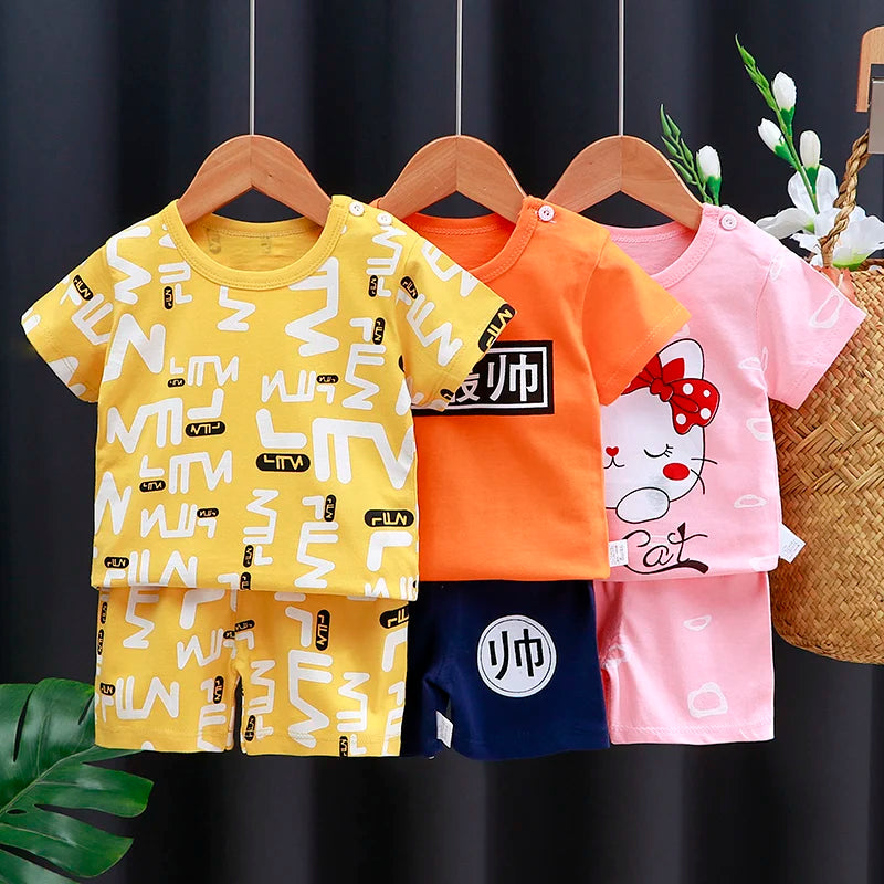 Focus on the neckline and sleeve features of the kids cartoon t-shirt and shorts casual set