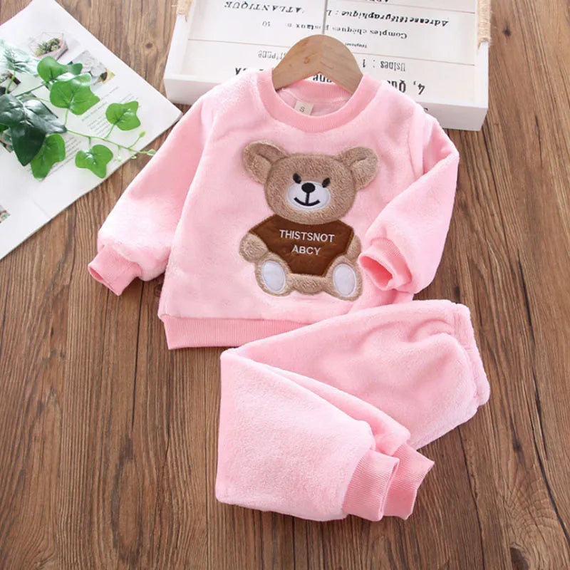 Close up highlighting the hem and stitching on the kids flannel fleece cartoon bear pyjama set