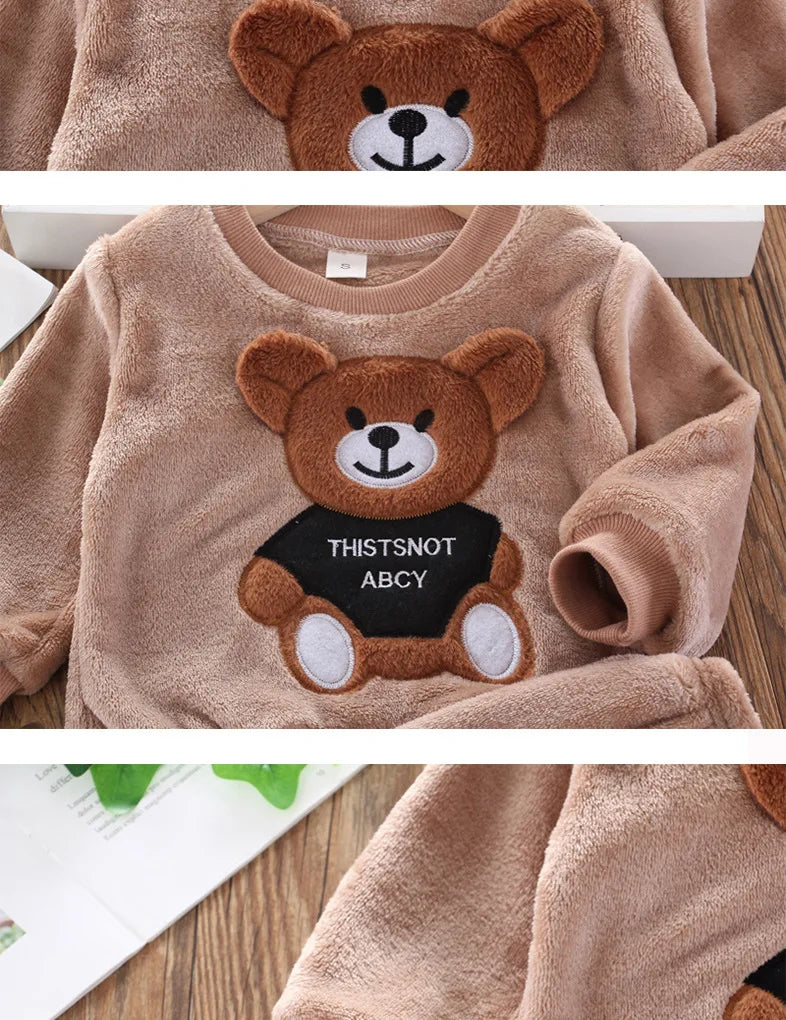 Focus on the neckline and sleeve features of the kids flannel fleece cartoon bear pyjama set