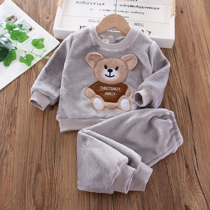 Occasion style layout showcasing the kids flannel fleece cartoon bear pyjama set