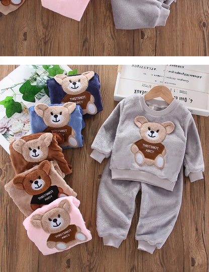 Close up highlighting the hem and stitching on the kids flannel fleece cartoon bear pyjama set