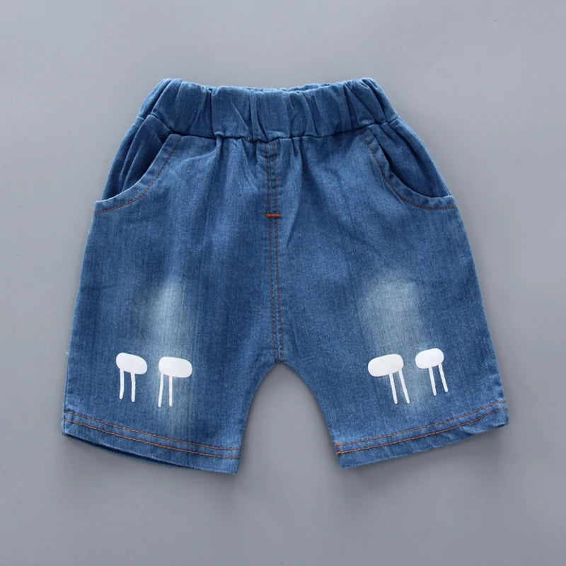 Baby boy wearing a smart casual shirt and denim shorts