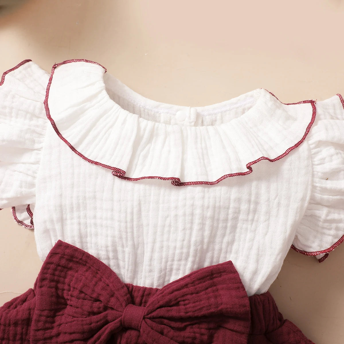 Style angle showing the baby girls red wine layered cupcake dress - view 3