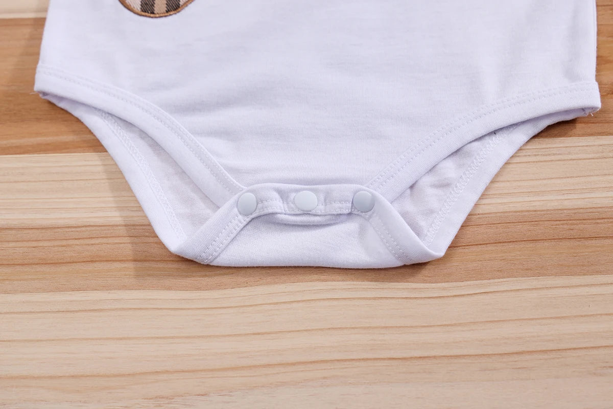 Fabric and texture detail of baby boys plaid bear bodysuit & trousers set
