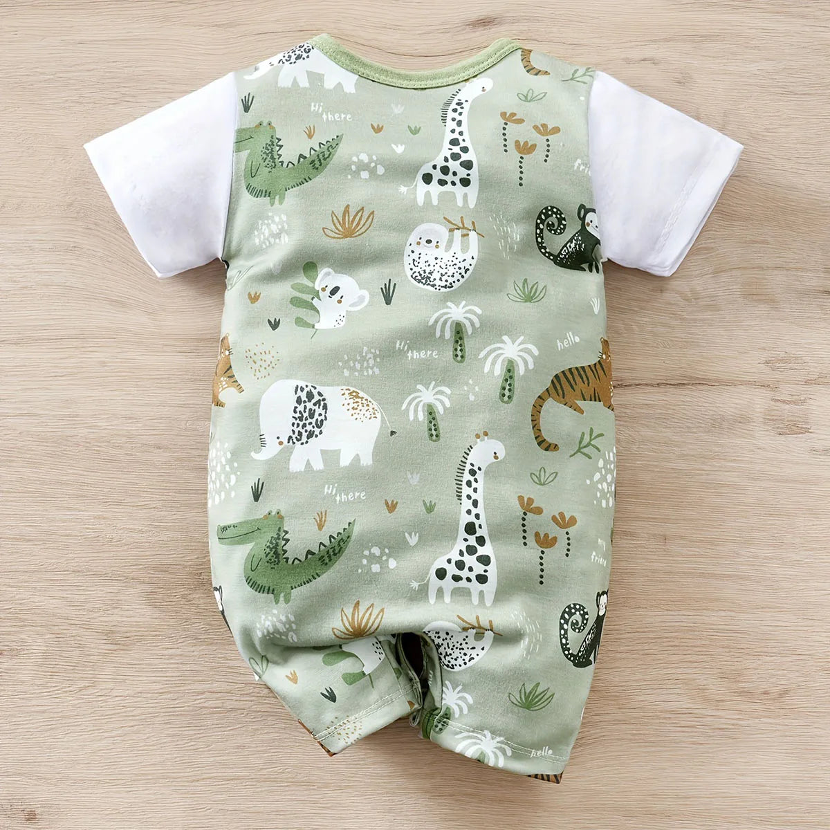 Detail view showing the fabric finish and pattern of the baby boys zoo animal print short sleeve romper