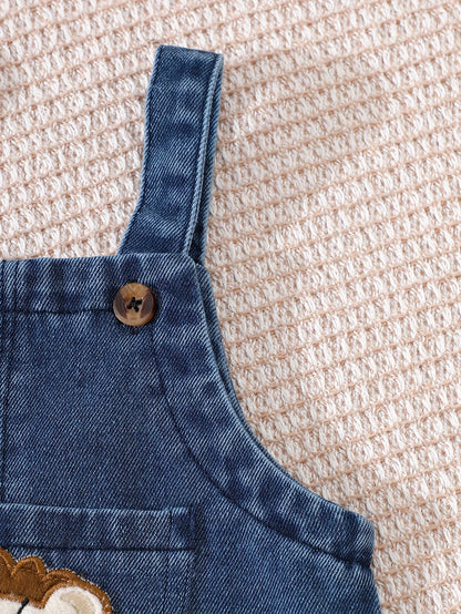 Side or lifestyle view of baby boys short sleeve top and lion overalls set