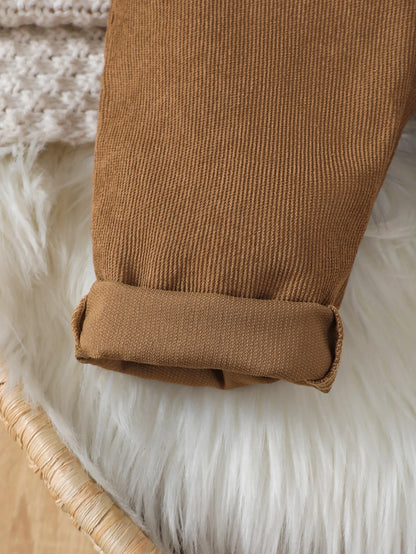 Side or lifestyle view of boys corduroy bear pattern bib overalls