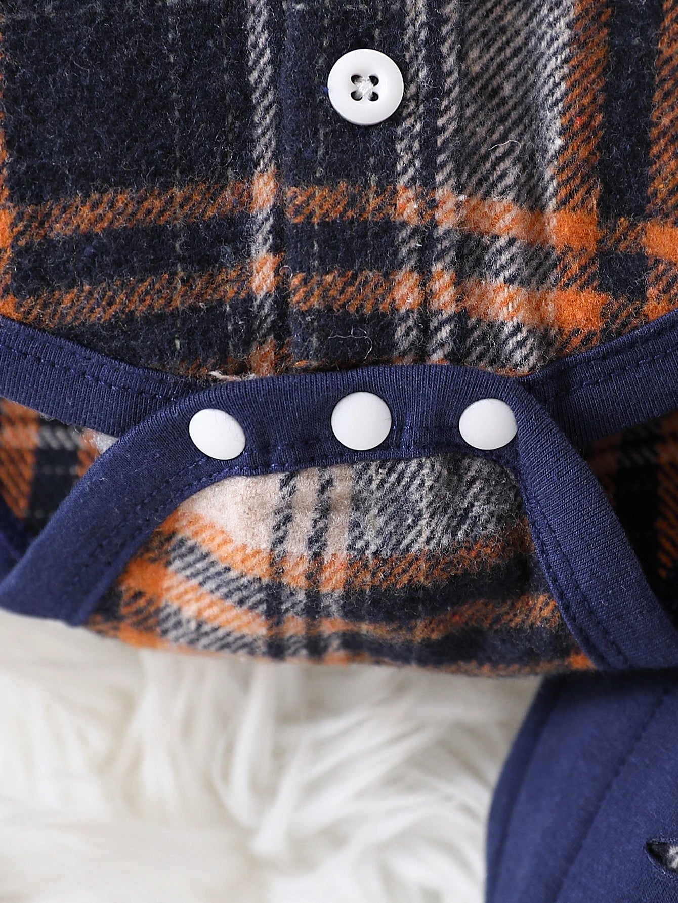 Fabric and texture detail of toddler boys plaid hooded top & overalls set