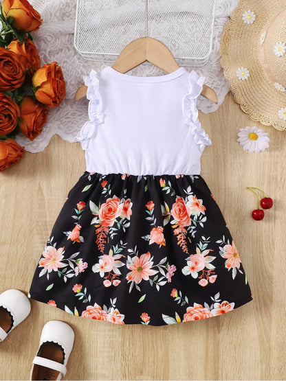 Baby girl wearing a sleeveless floral party dress with a bow