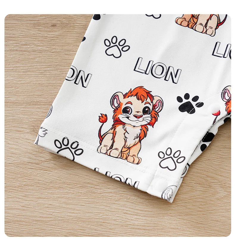 Baby wearing a short-sleeve romper with a lion print and faux two-piece design