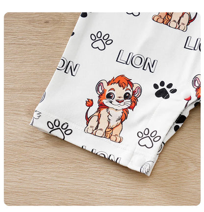 Baby wearing a short-sleeve romper with a lion print and faux two-piece design