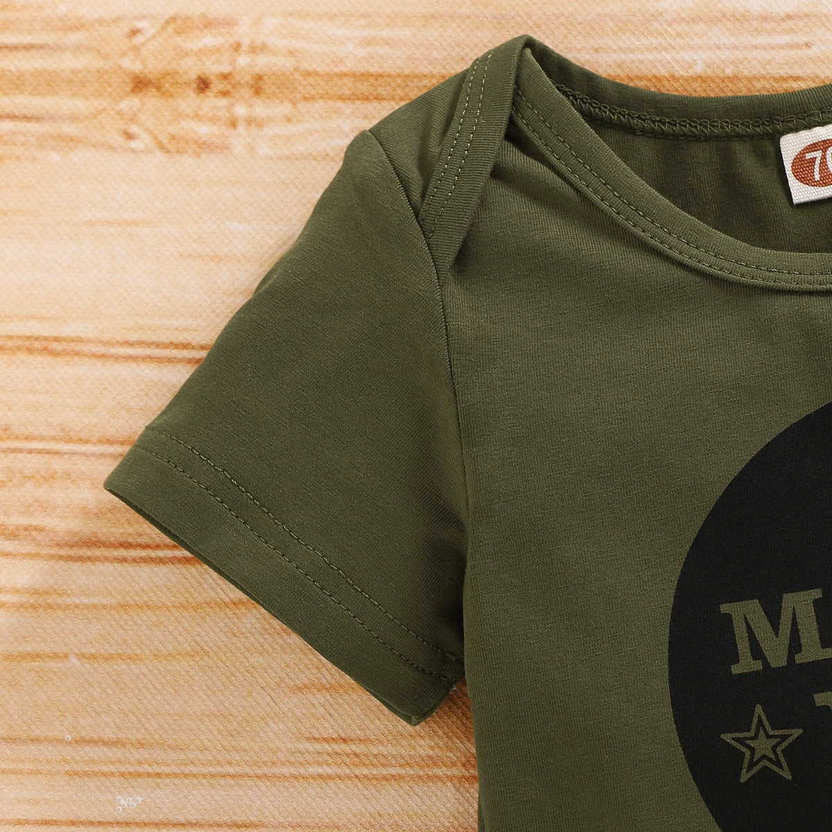 Occasion style layout showcasing the baby boys camouflage shorts and letter print romper set