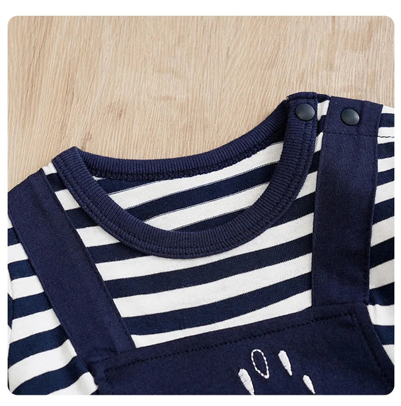 Detail view showing the fabric finish and pattern of the baby striped elephant and giraffe print romper