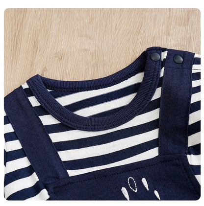 Detail view showing the fabric finish and pattern of the baby striped elephant and giraffe print romper