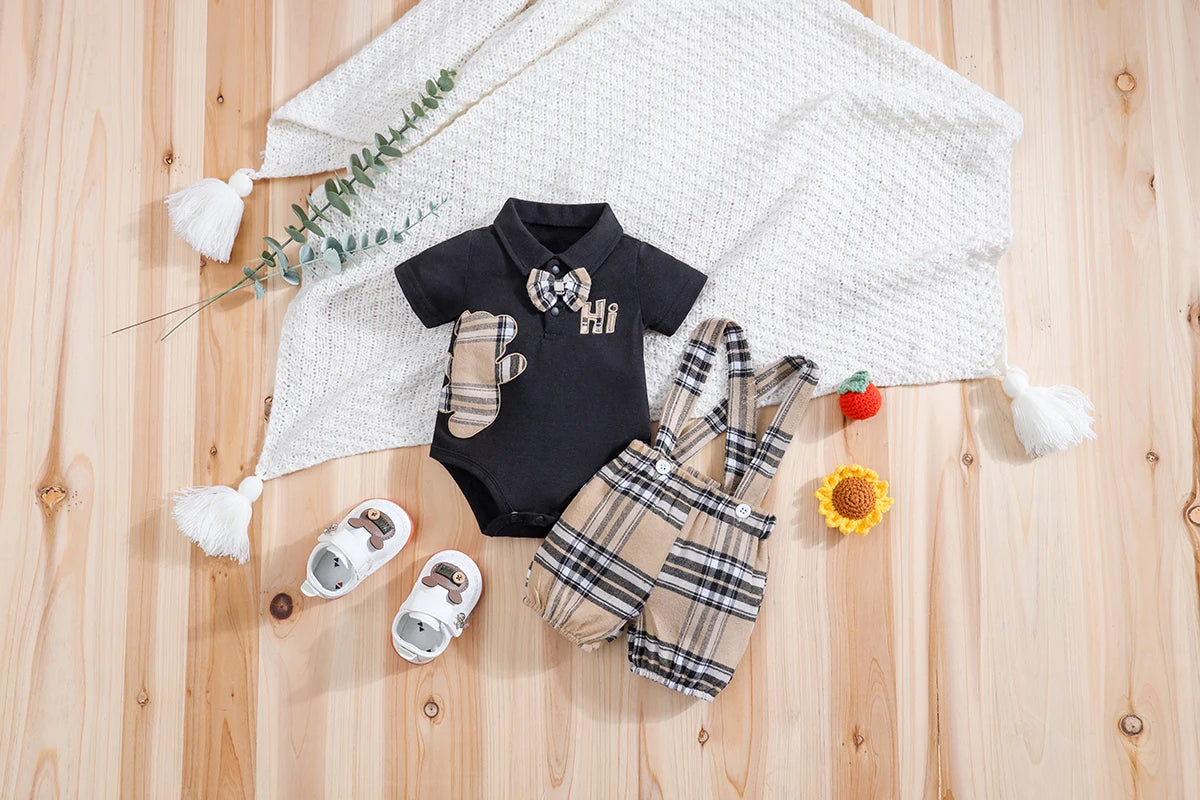 Close up detail of baby boys plaid bear bodysuit & trousers set