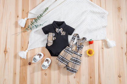 Close up detail of baby boys plaid bear bodysuit & trousers set