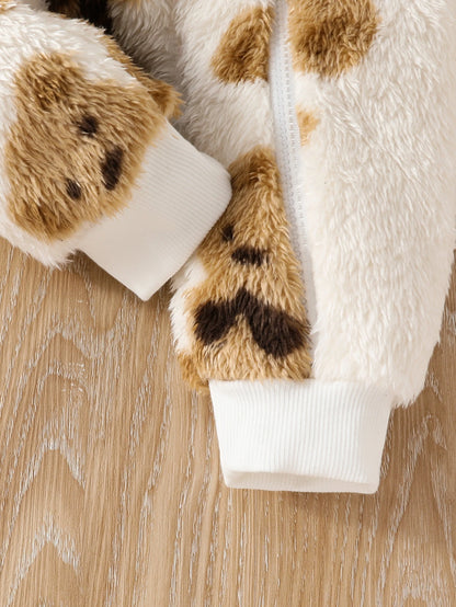 Side or lifestyle view of baby girls fluffy teddy bear print onesie