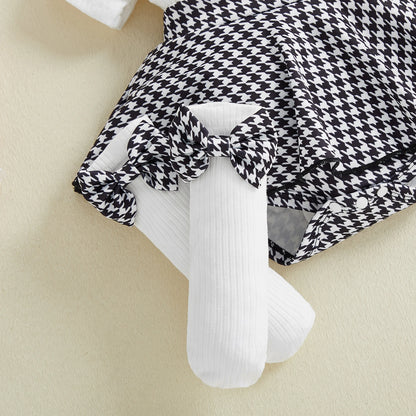Fabric and texture detail of baby girls houndstooth romper dress set