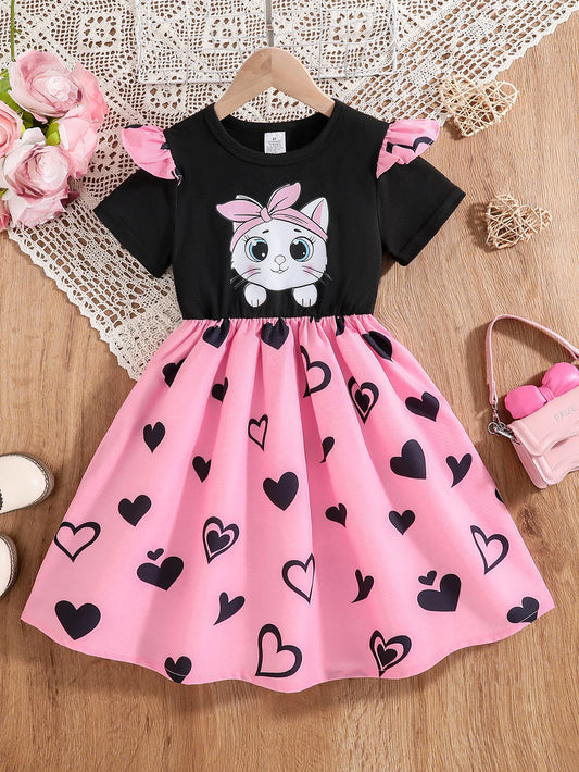 Girl wearing a mid-length dress with a cat and heart print and flutter sleeves