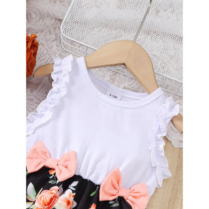 Baby girl wearing a sleeveless floral party dress with a bow