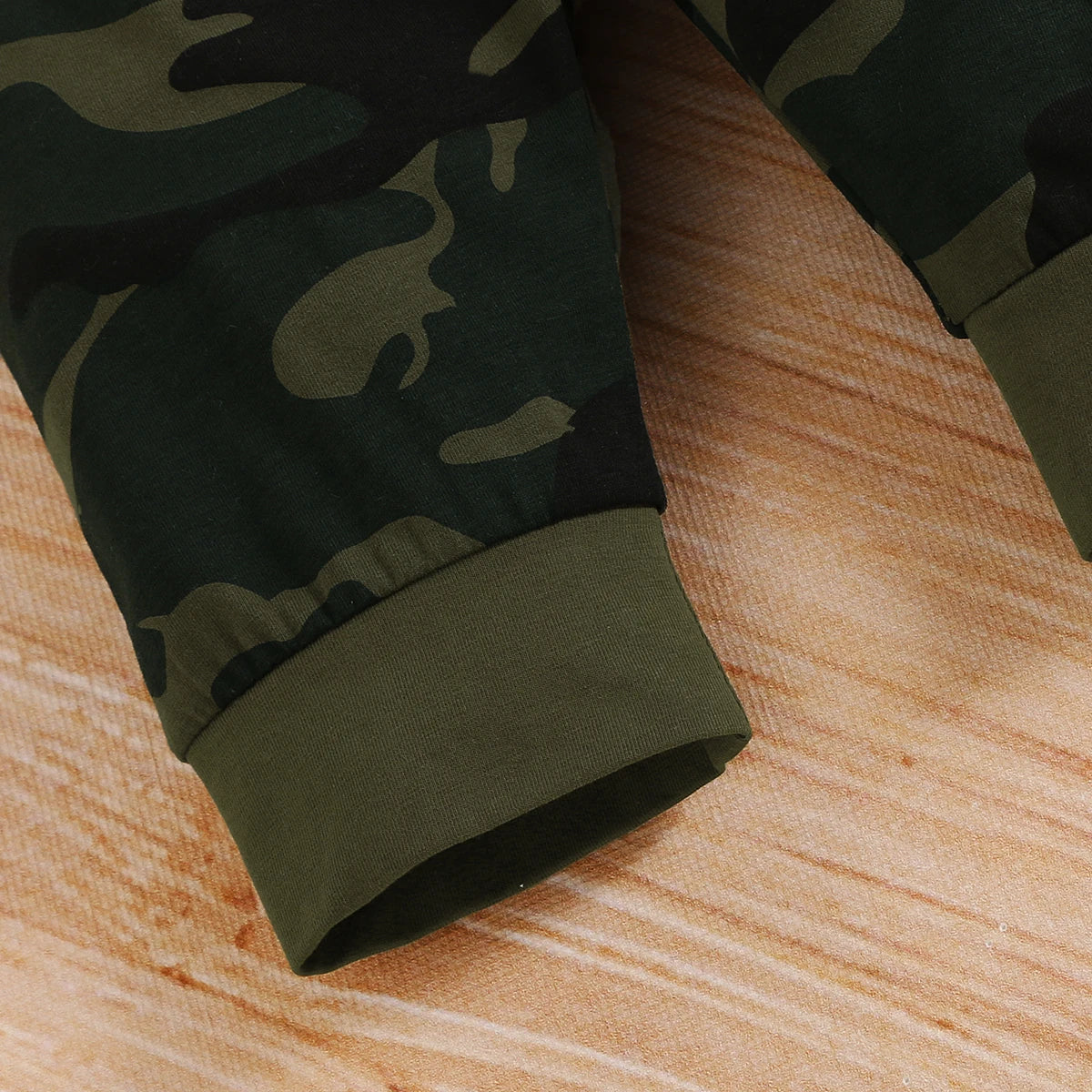 Styling option and alternate perspective of the baby boys camouflage shorts and letter print romper set