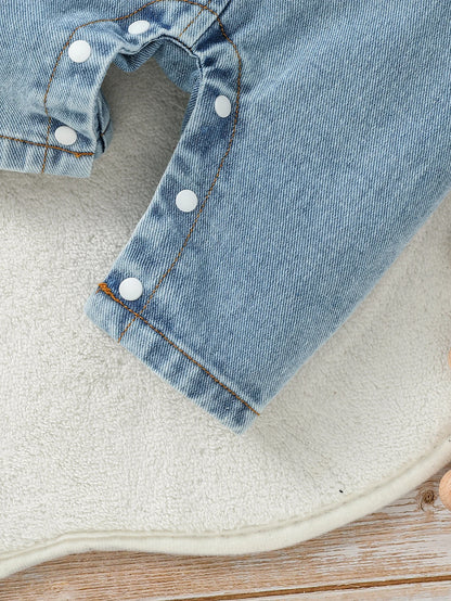 Close up detail of baby boys long sleeve romper top & trousers