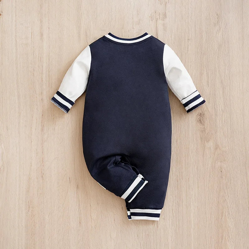 Detail view showing the fabric finish and pattern of the baby boys cotton baseball romper