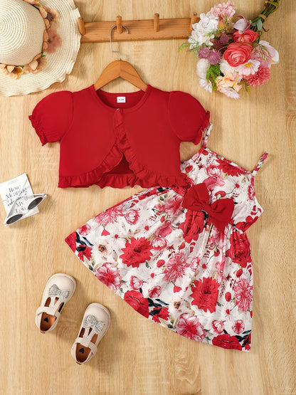 Girl wearing a puff sleeve top and a floral skirt with suspender straps