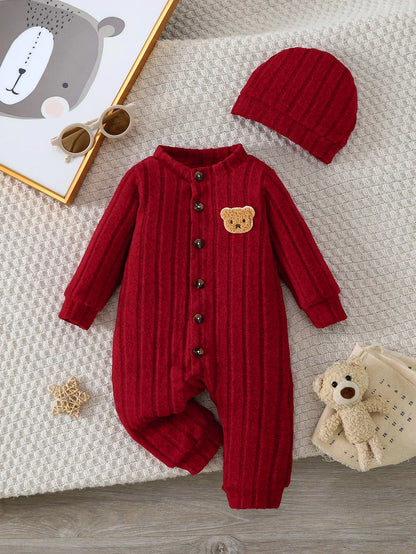 Focus on the neckline and sleeve features of the baby red bear badge winter onesie and hat set