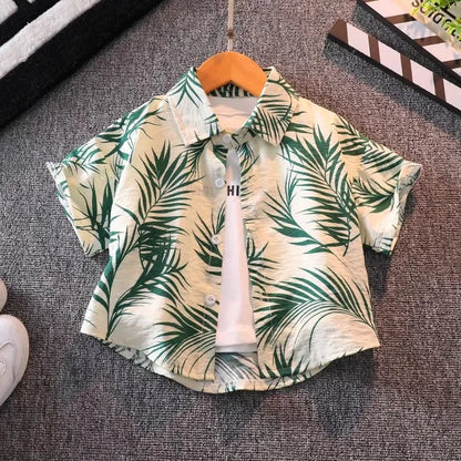 Style angle showing the boys floral beach shirt and shorts set - view 3