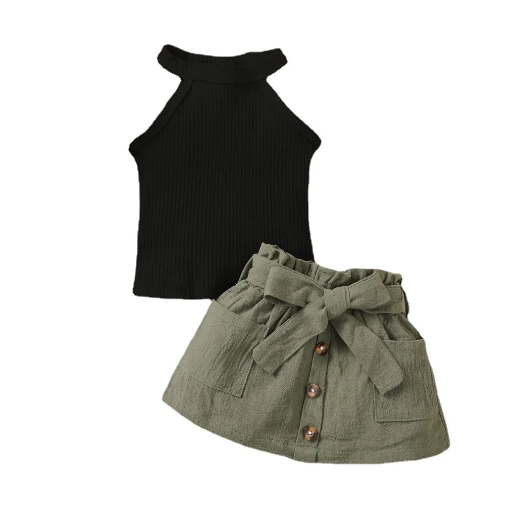 Baby girl wearing a ribbed halter top and matching short skirt