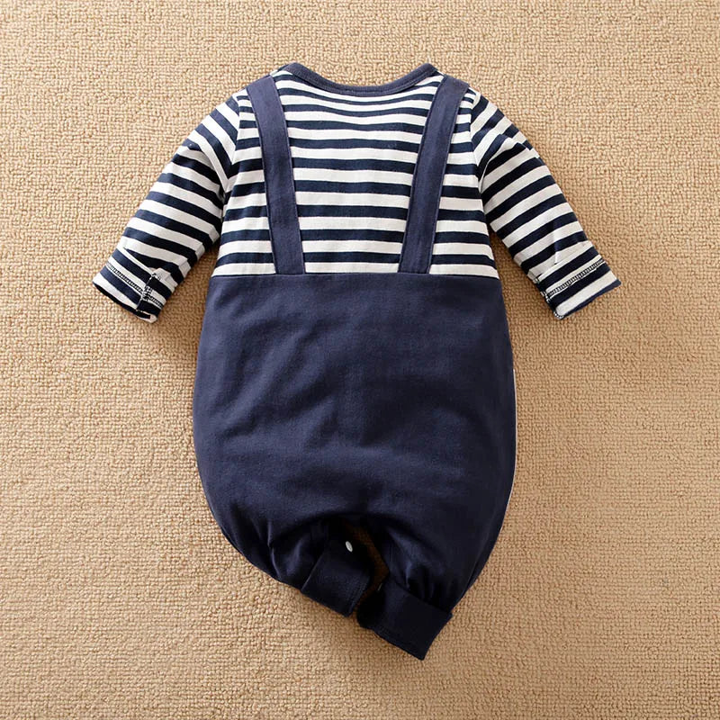 Detail view showing the fabric finish and pattern of the baby striped elephant and giraffe print romper