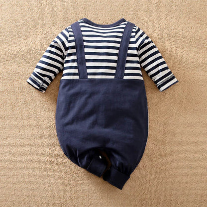 Detail view showing the fabric finish and pattern of the baby striped elephant and giraffe print romper