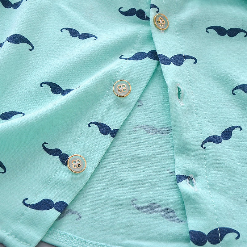 Side view of boys printed summer shirt & shorts suit