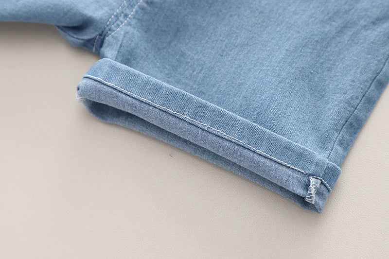 Pattern and styling on the boys striped shirt and denim shorts set - view 14