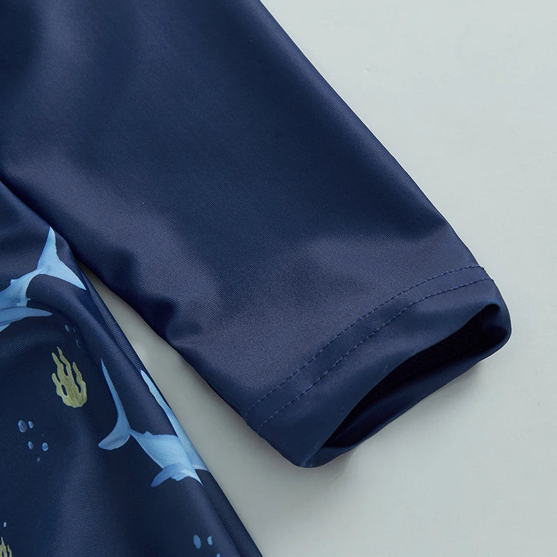 Detail shot of the Sky Blue boys shark print long sleeve rash guard swimwear set