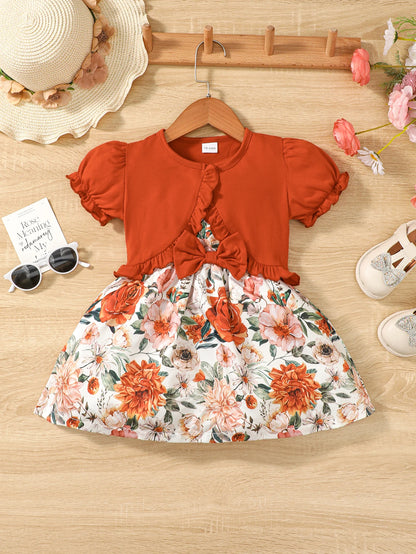 Girl wearing a puff sleeve top and a floral skirt with suspender straps
