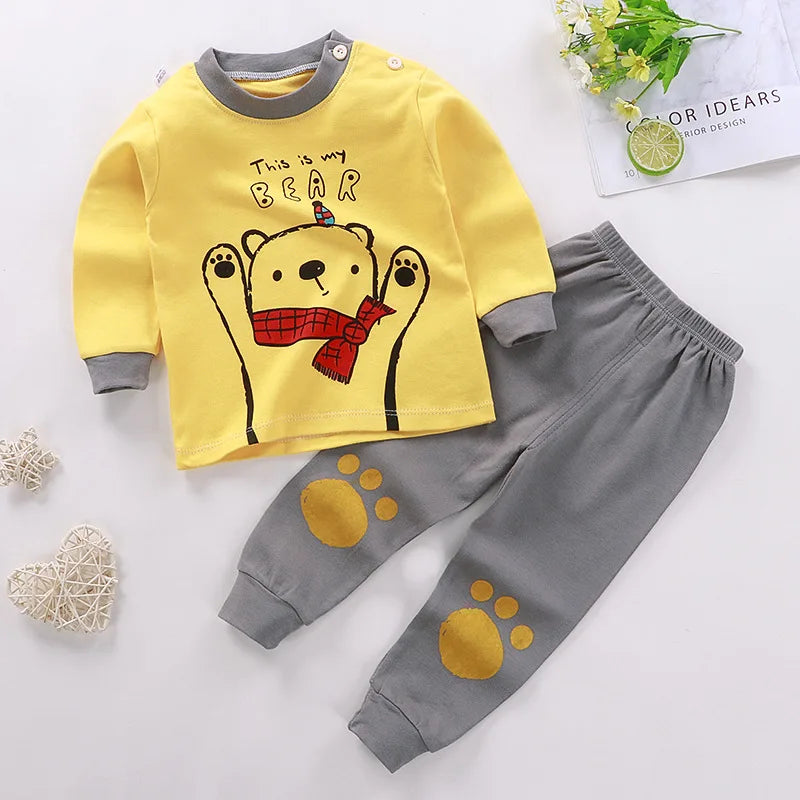 Kids two-piece cotton pyjama set with long-sleeve cartoon top and trousers