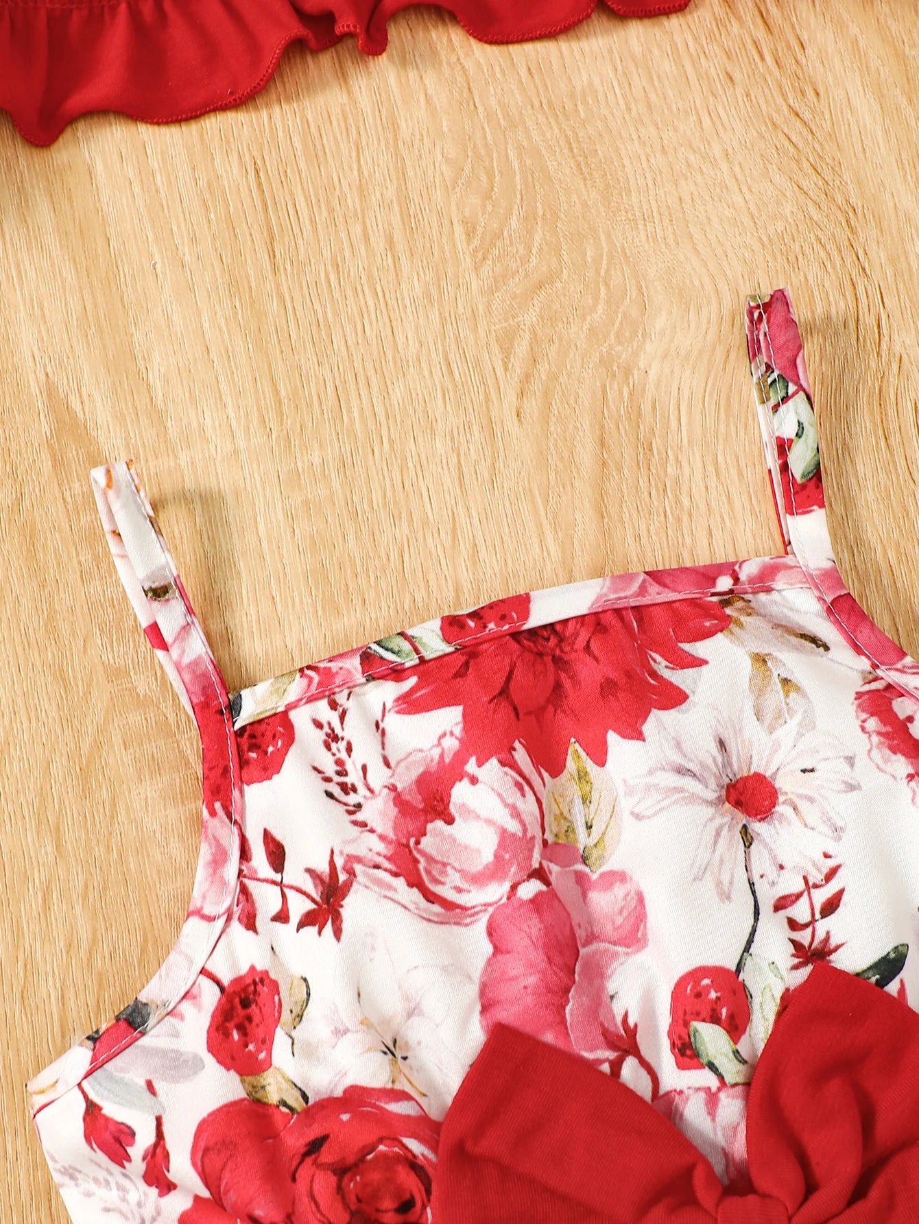 Girl wearing a puff sleeve top and a floral skirt with suspender straps