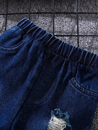 Close up detail of boys tartan polo shirt & denim trousers set