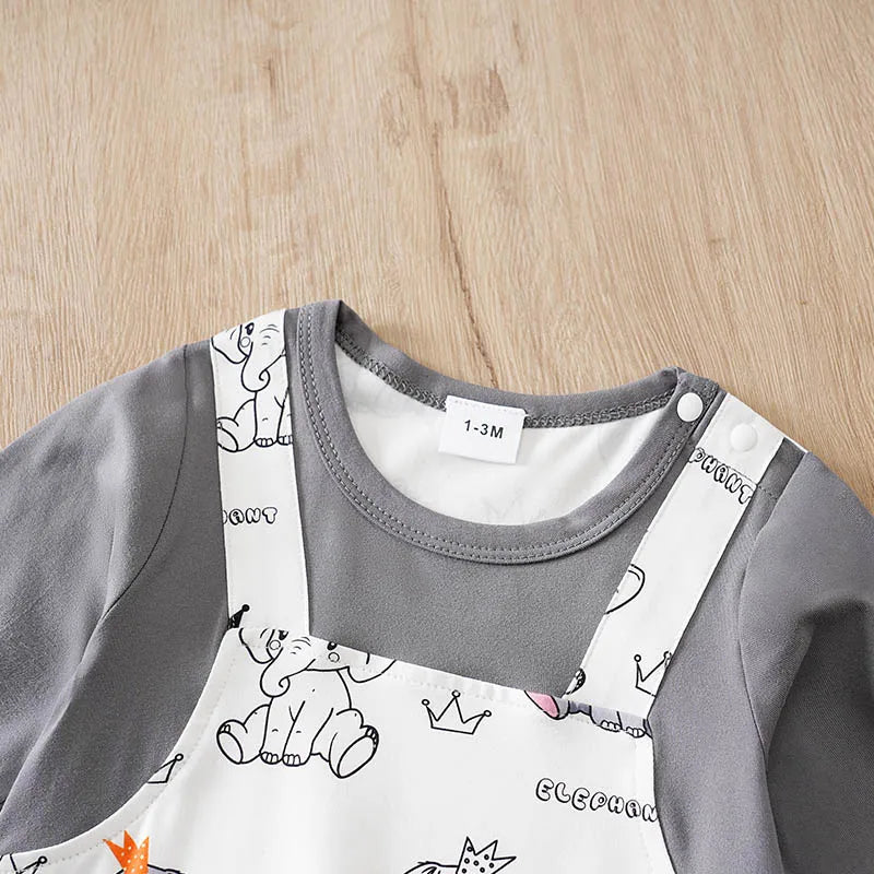Baby boy wearing a long-sleeve romper with an elephant print and faux braces
