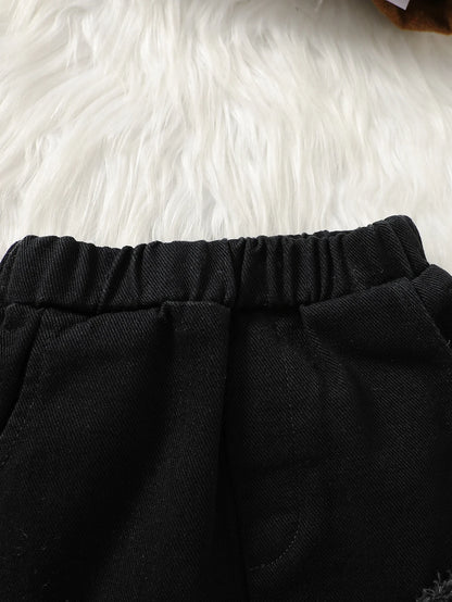 Fabric and texture detail of boys striped hooded jacket & ripped pants