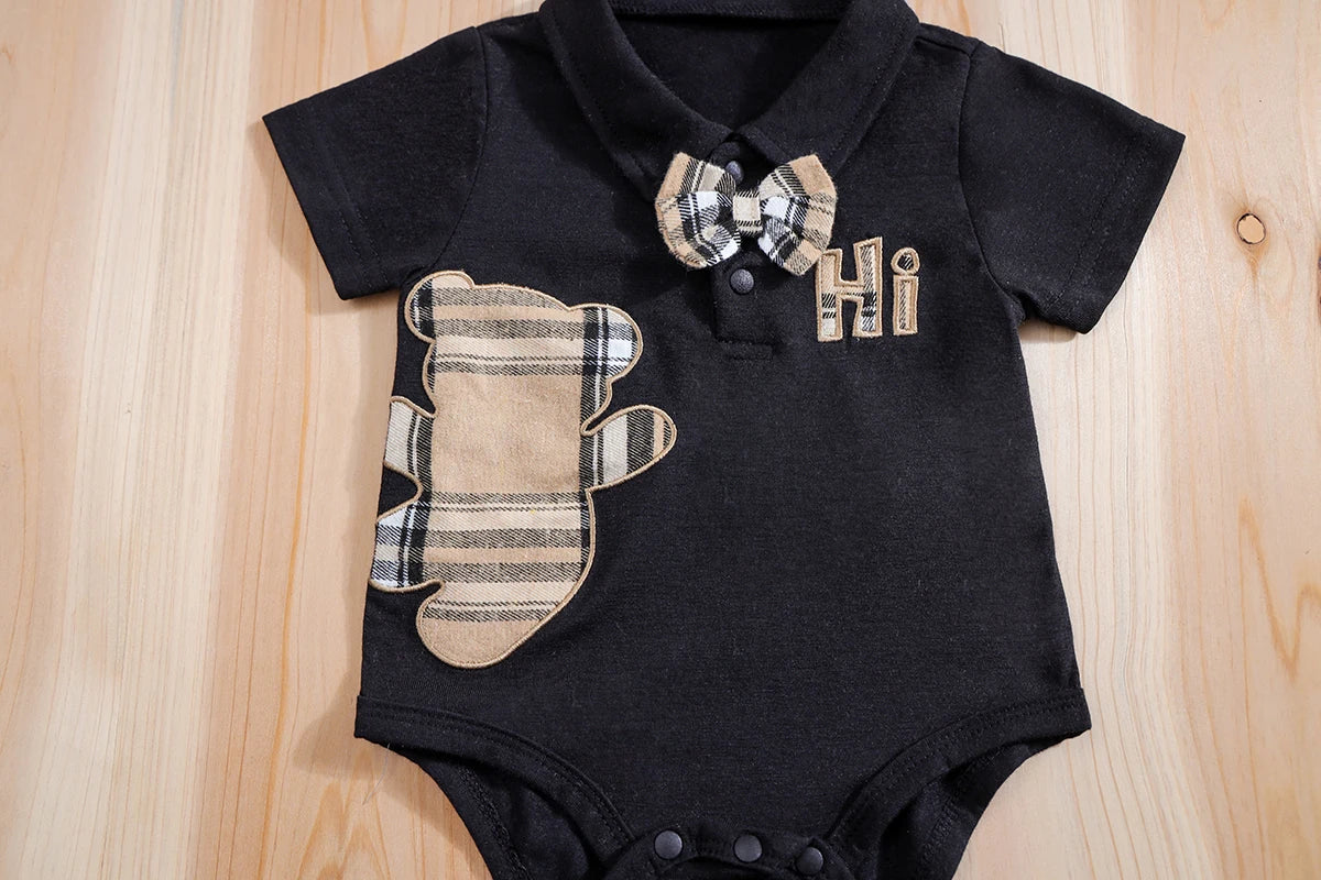 Close up detail of baby boys plaid bear bodysuit & trousers set
