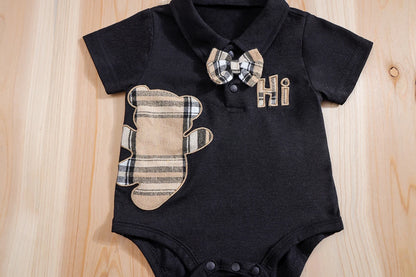 Close up detail of baby boys plaid bear bodysuit & trousers set