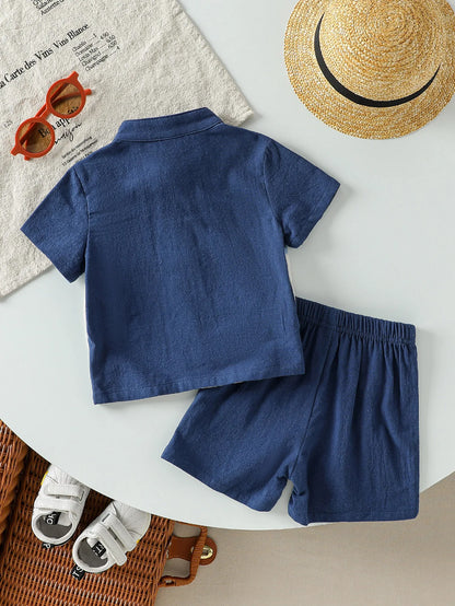 Detail view showing the fabric finish and pattern of the baby boys patchwork short sleeve shirt and shorts set