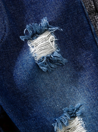 Fabric and texture detail of boys tartan polo shirt & denim trousers set