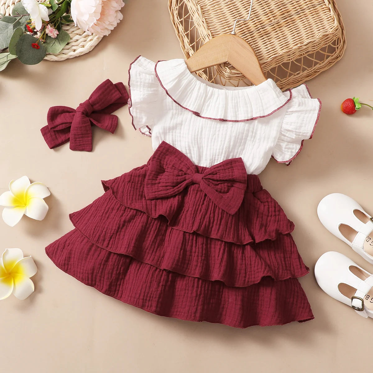 Side view of the baby girls red wine layered cupcake dress - view 8