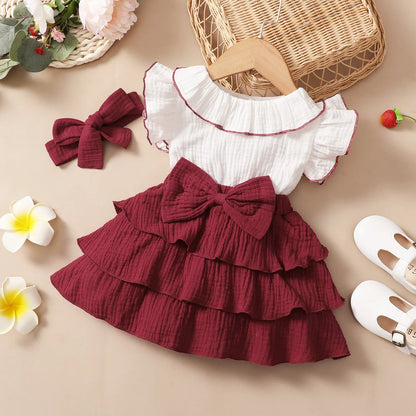 Side view of the baby girls red wine layered cupcake dress - view 8